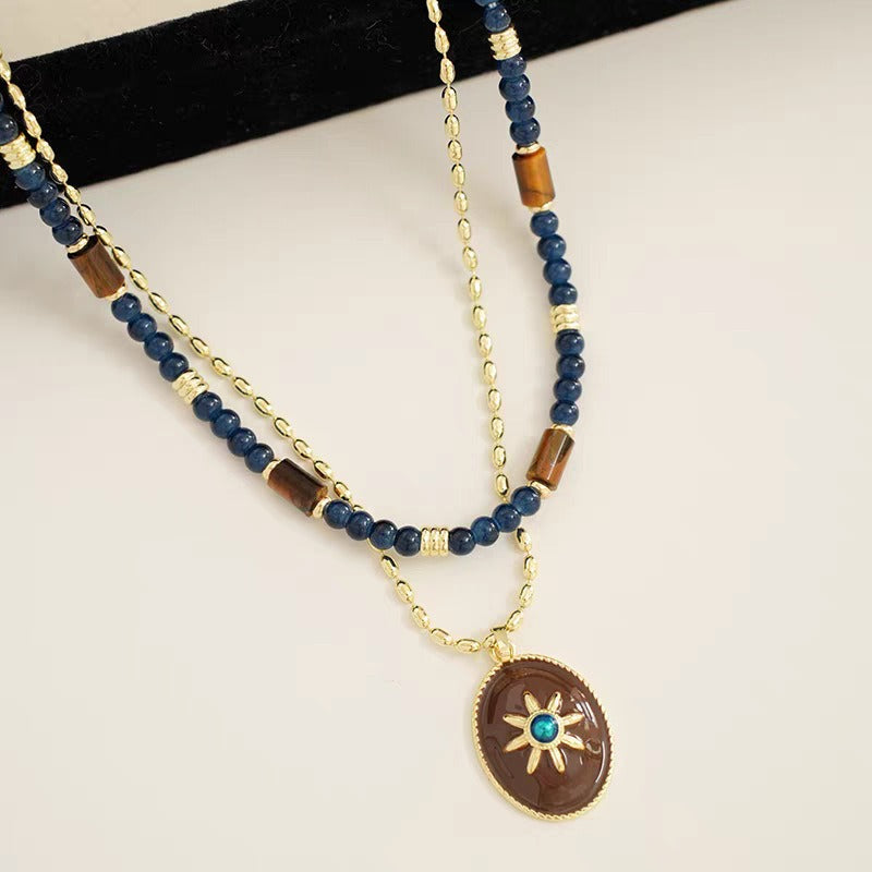 Caivera Gold Plated Brass Double Layer Necklace Set – Blue Beads and Brown Wood Pendant