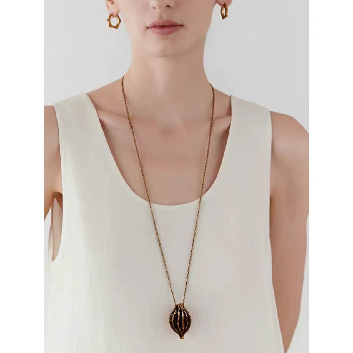 Caivera Gold Plated Brass Long Pendant Necklace – Ribbed Oval Pendant, 31 inch